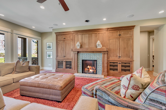 2579 Splendor Valley Road Kamas, UT 84036 - Photo 61 of 87 Living area with recessed lighting, ceiling fan, and a warm lit fireplace
