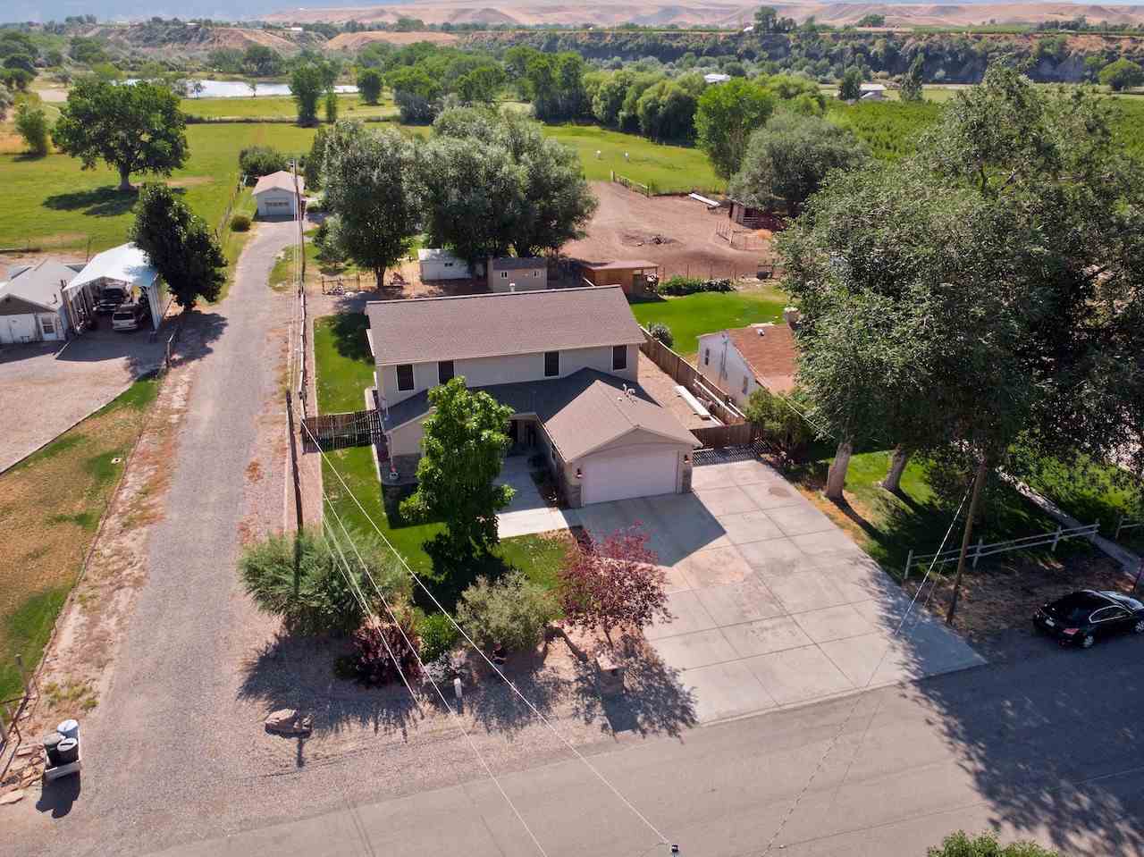 588 35 Road Clifton, CO 81520 - Photo 1 of 31 an aerial view of a houses with a lake view
