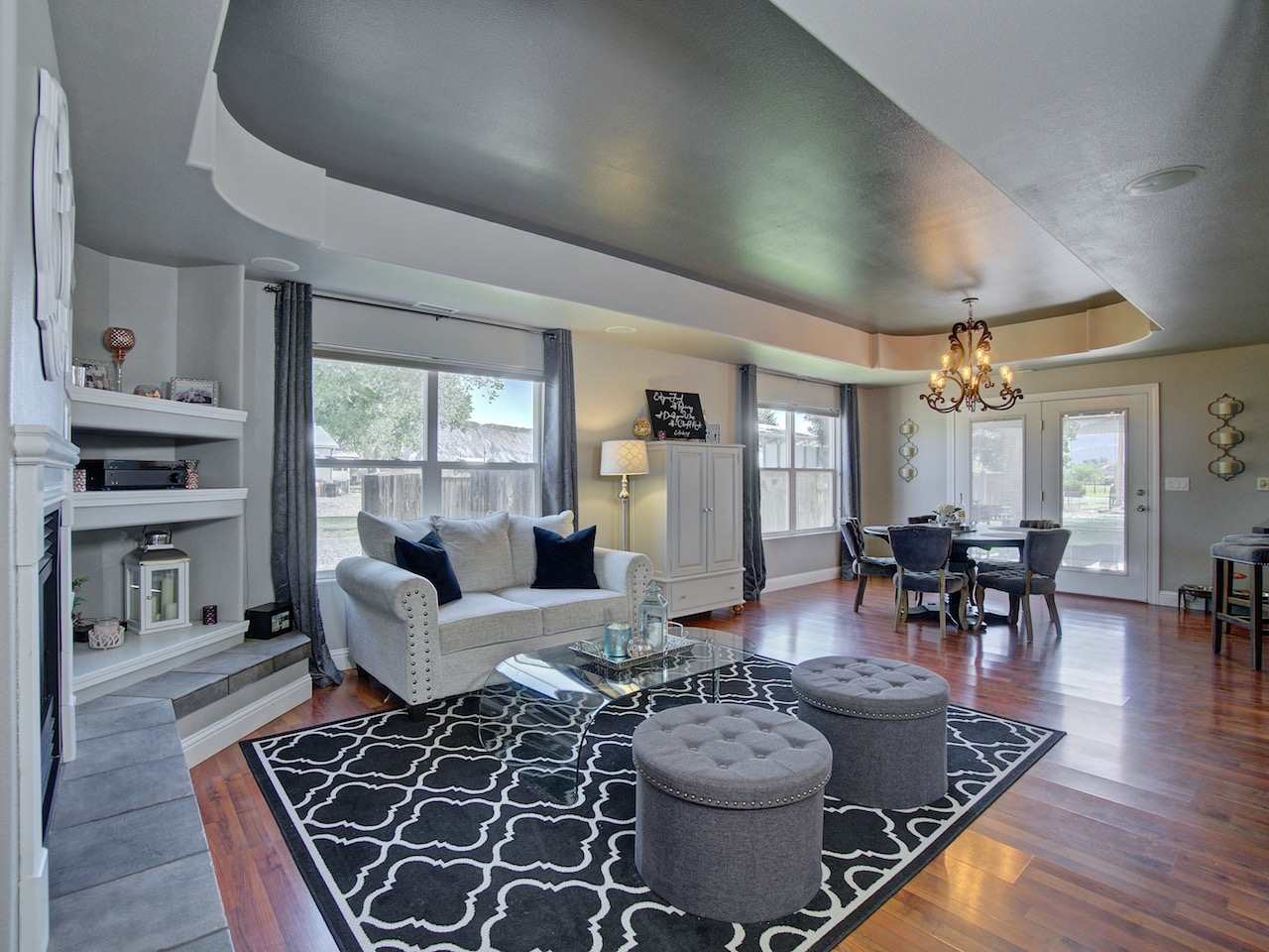588 35 Road Clifton, CO 81520 - Photo 5 of 31 a living room with fireplace furniture and a large window