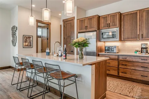 a kitchen with cabinets and window