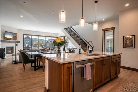 a kitchen with stainless steel appliances kitchen island a large island in the center