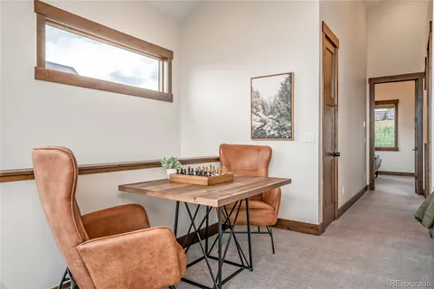 a dining room with furniture and window