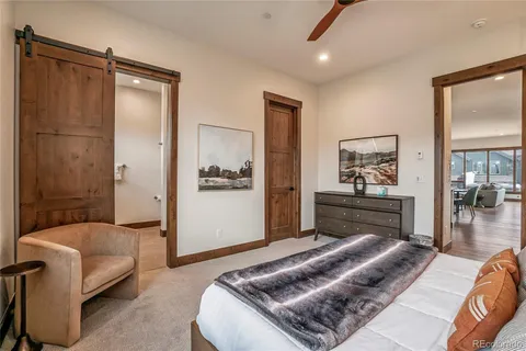 a bedroom with a bed and a couch