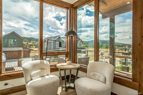 a living room with large windows