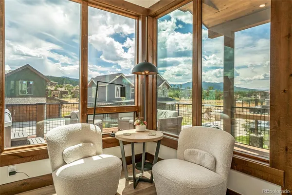 a living room with large windows