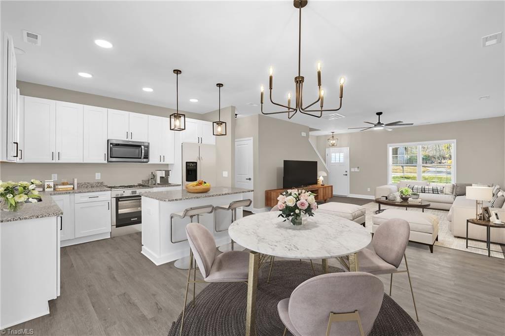 2603 Cromwell Road Greensboro, NC 27407 - Photo 13 of 34 virtually staged dining area and kitchen