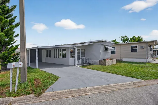 a view of a porch with wooden floor and fence