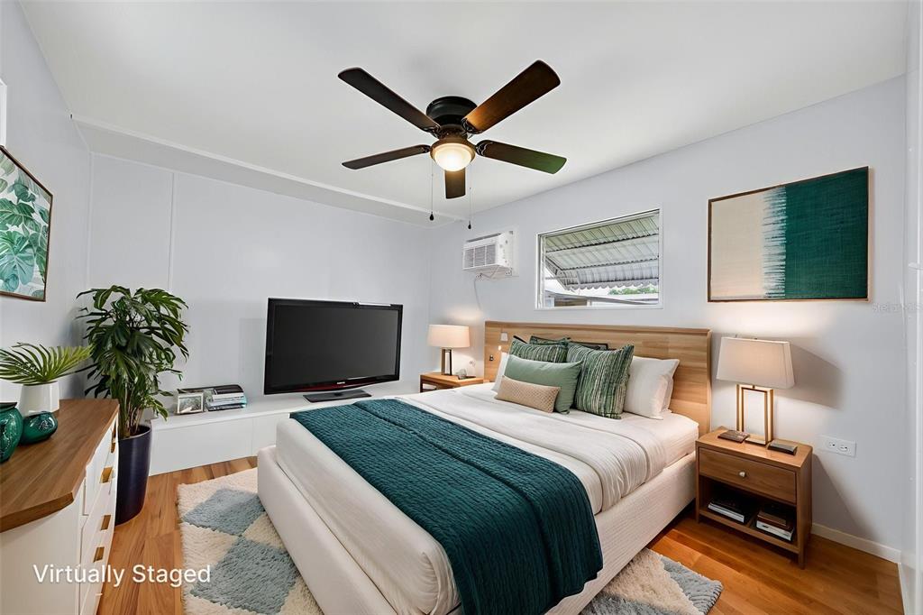 5162 Boca Raton Avenue Sarasota, FL 34234 - Photo 22 of 42 a bedroom with a bed and a flat screen tv