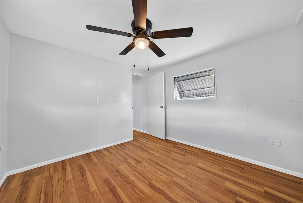 5162 Boca Raton Avenue Sarasota, FL 34234 - Photo 23 of 42 a view of empty room with wooden floor