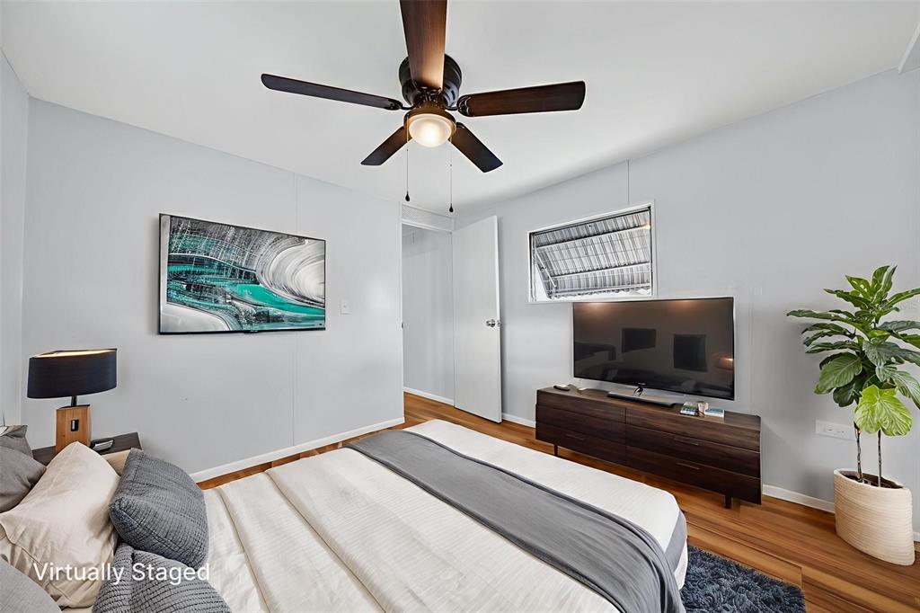 5162 Boca Raton Avenue Sarasota, FL 34234 - Photo 24 of 42 a bedroom with a bed and a flat screen tv