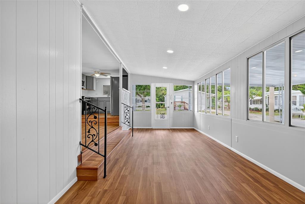 5162 Boca Raton Avenue Sarasota, FL 34234 - Photo 8 of 42 wooden floor in an empty room with a window