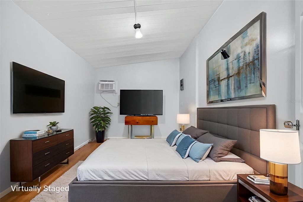 5162 Boca Raton Avenue Sarasota, FL 34234 - Photo 9 of 42 a bedroom with a bed and a flat screen tv