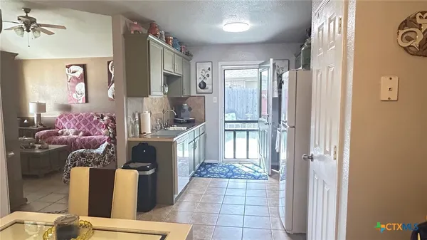 a kitchen with stainless steel appliances a stove and a refrigerator