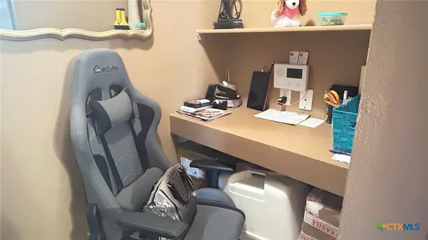 a view of a house with a yard and garden