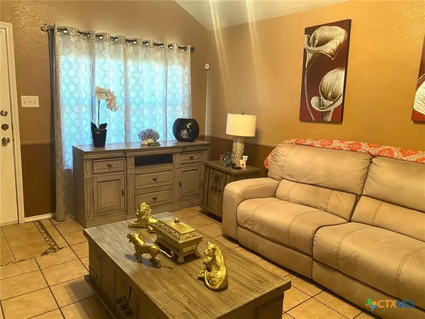 a kitchen with stainless steel appliances granite countertop a stove and a microwave