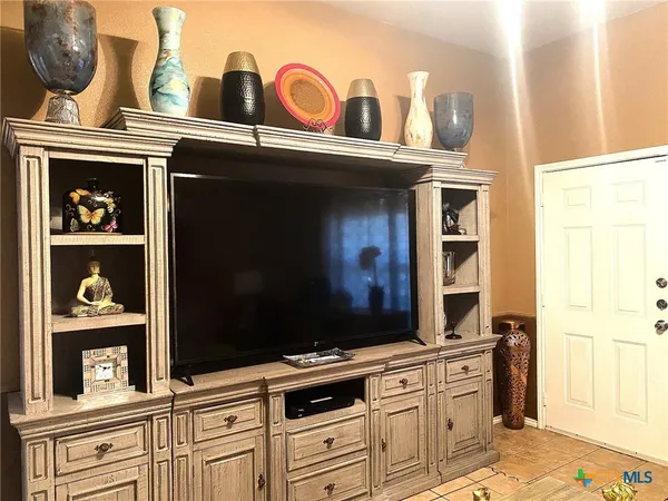 a view of living room with furniture and chandelier
