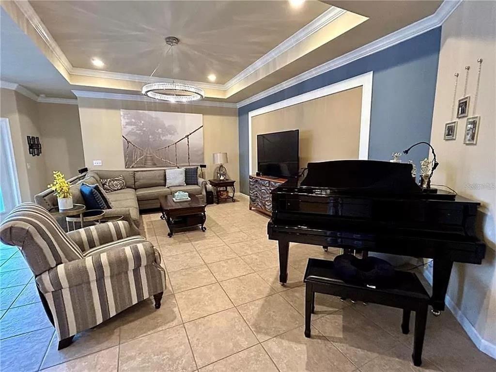 9883 Northwest 17th Road Gainesville, FL 32606 - Photo 4 of 11 a living room with furniture and a flat screen tv
