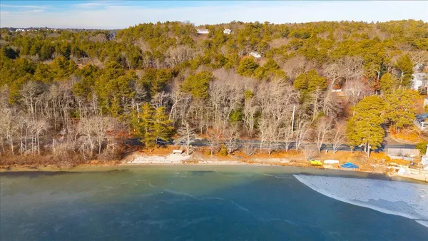 a view of a house with backyard porch and sitting area