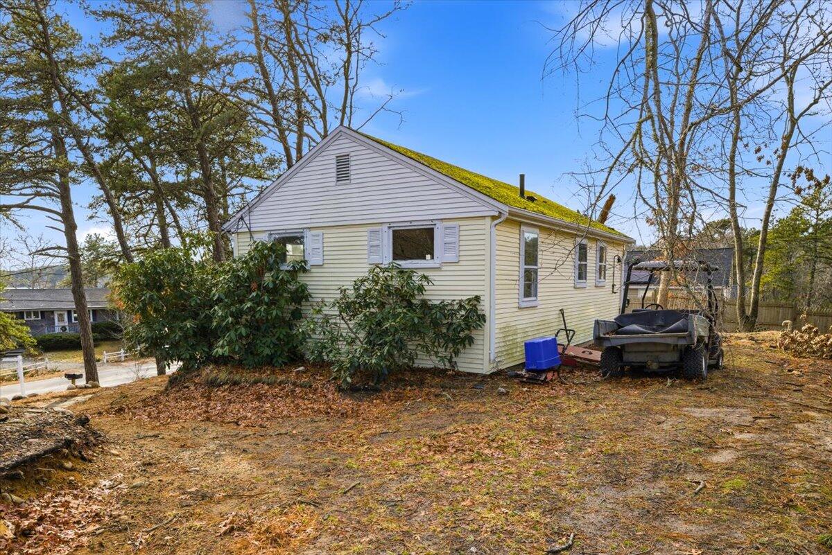 53 Carter's Bridge Road Plymouth, MA 02360 - Photo 19 of 30 a view of house and a yard with large trees