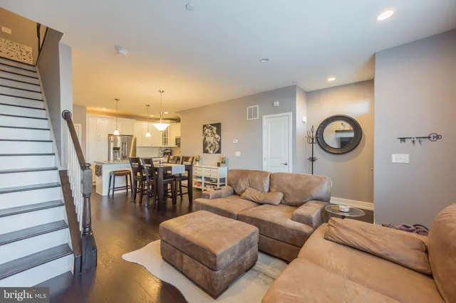 a living room with furniture and a table