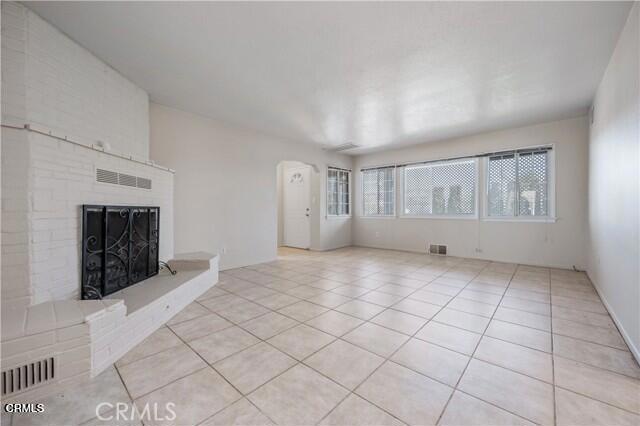 45027 Division Street Lancaster, CA 93535 - Photo 3 of 11 an empty room with windows