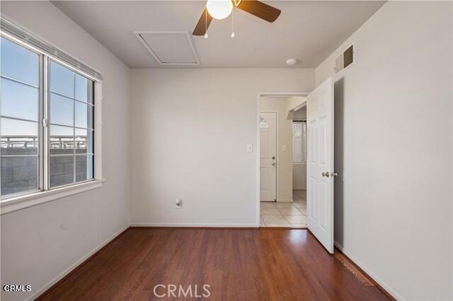 45027 Division Street Lancaster, CA 93535 - Photo 8 of 11 wooden floor in an empty room with a window