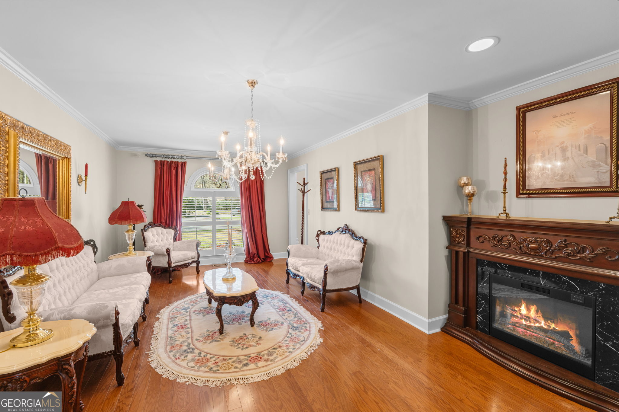 109 Crest Pointe Warner Robins, GA 31088 - Photo 18 of 86 a living room with furniture a chandelier and a fireplace