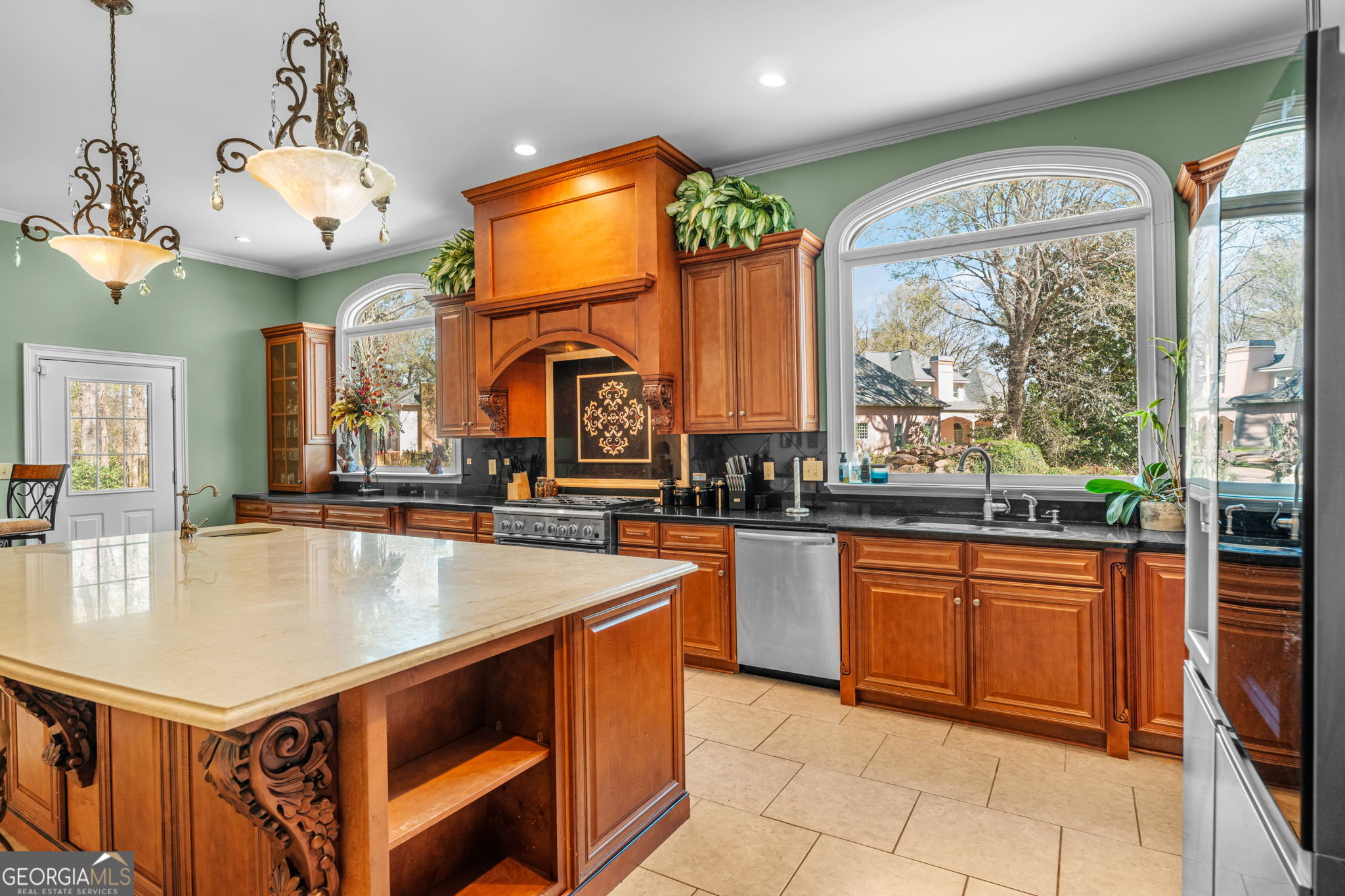 109 Crest Pointe Warner Robins, GA 31088 - Photo 22 of 86 a large kitchen with stainless steel appliances granite countertop a stove and a sink