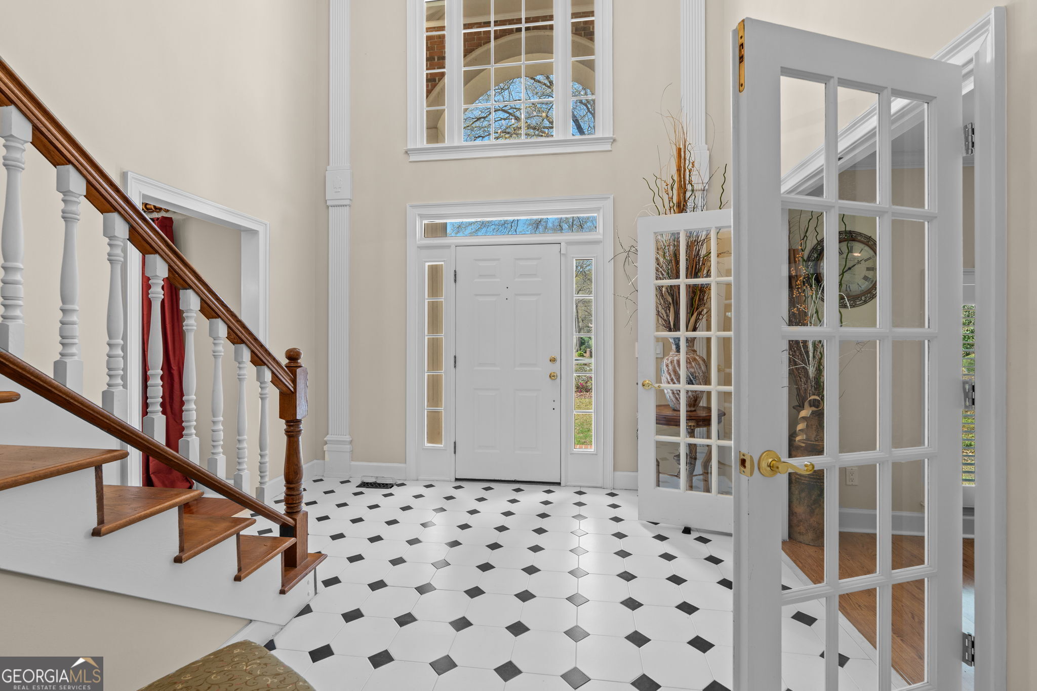 109 Crest Pointe Warner Robins, GA 31088 - Photo 26 of 86 a view of a hallway with wooden floor and staircase