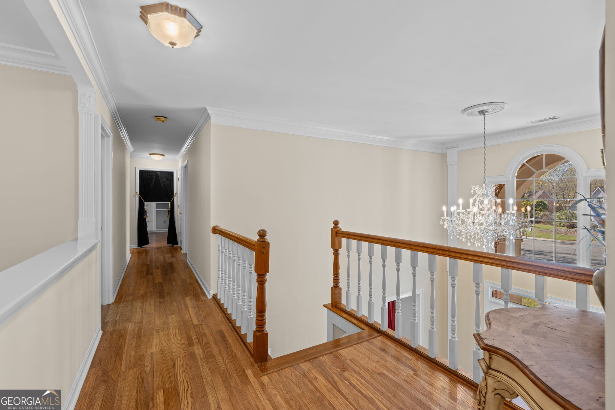 109 Crest Pointe Warner Robins, GA 31088 - Photo 45 of 86 a view of a hallway with wooden floor and staircase