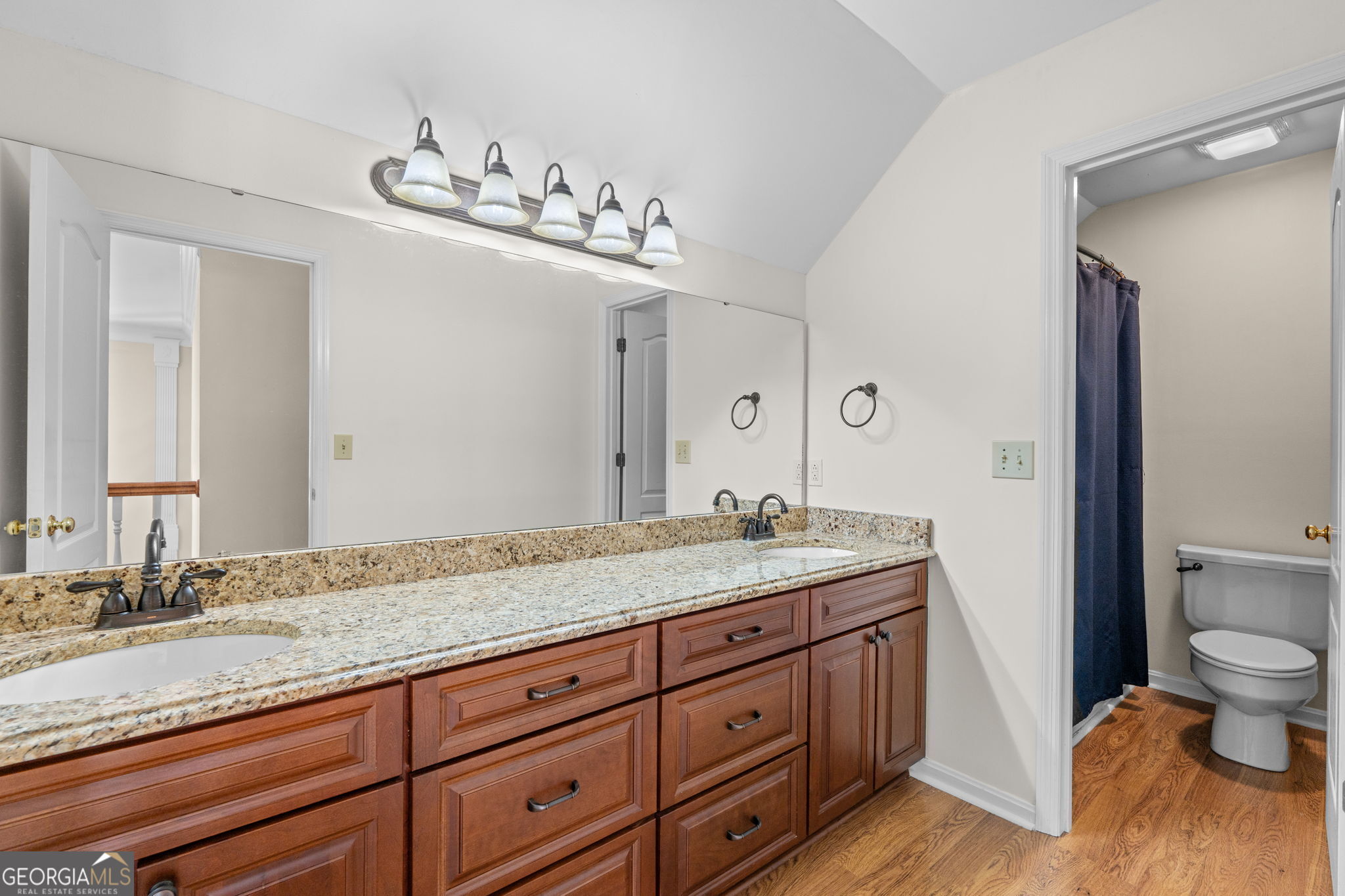 109 Crest Pointe Warner Robins, GA 31088 - Photo 63 of 86 a spacious bathroom with a granite countertop sink a toilet and a mirror
