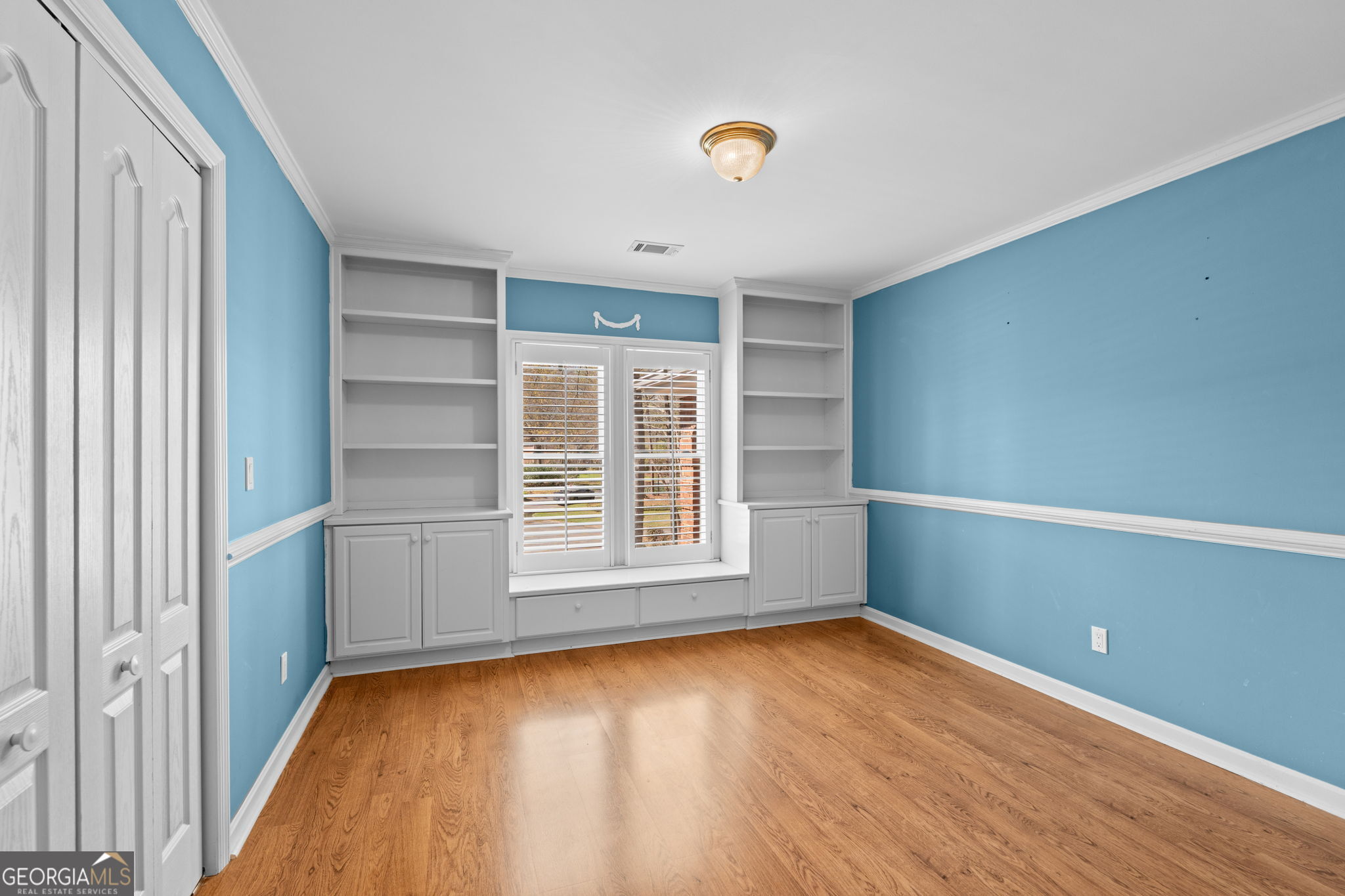 109 Crest Pointe Warner Robins, GA 31088 - Photo 65 of 86 an empty room with wooden floor and windows