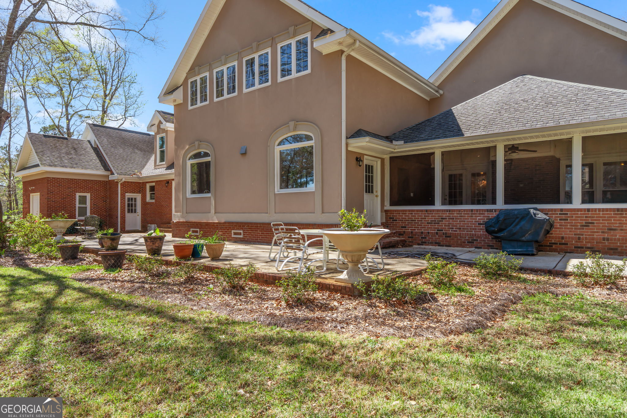 109 Crest Pointe Warner Robins, GA 31088 - Photo 81 of 86 a front view of a house with a yard outdoor seating and garage