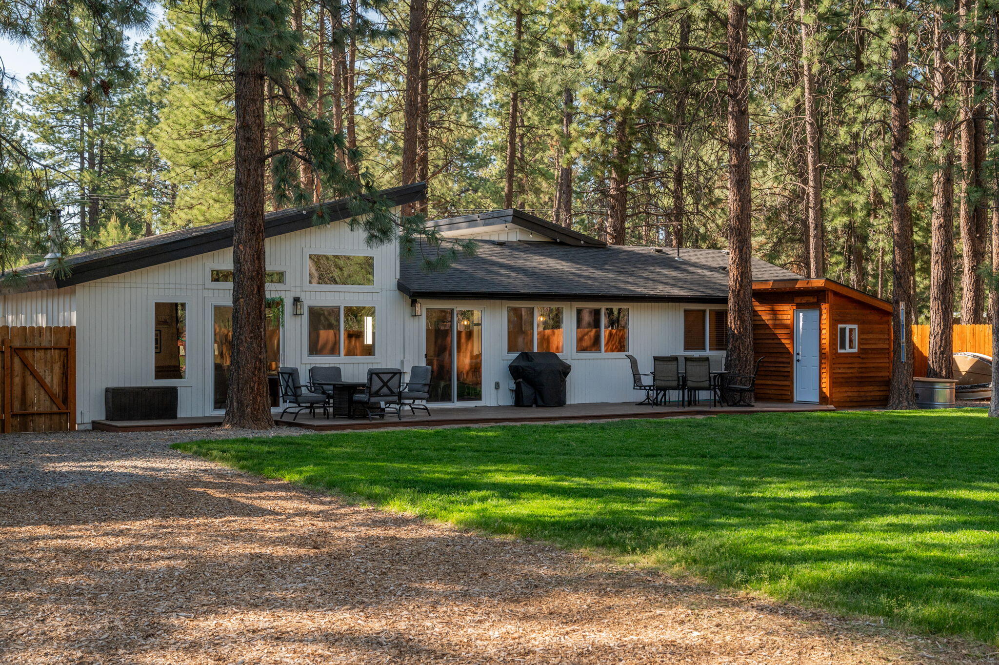 60072 Cinder Butte Road Bend, OR 97702 - Photo 44 of 60 a front view of a house with a garden and trees