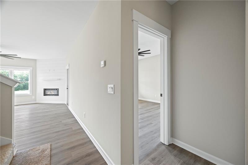 693 Racetrack Road Toccoa, GA 30577 - Photo 7 of 45 a view of a hallway with wooden floor and a bathroom