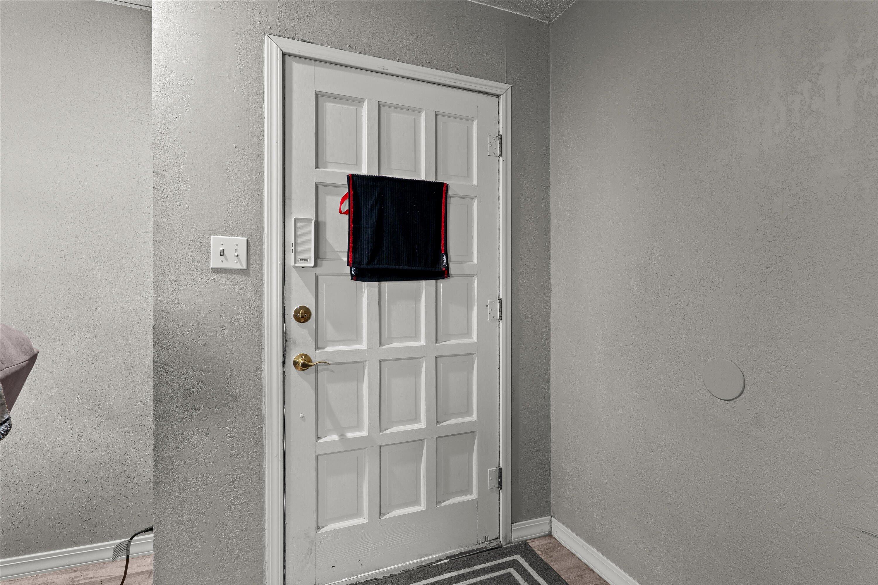 102 3rd Street Plains, TX 79355 - Photo 20 of 29 a living room with a flat screen tv and a wall painting