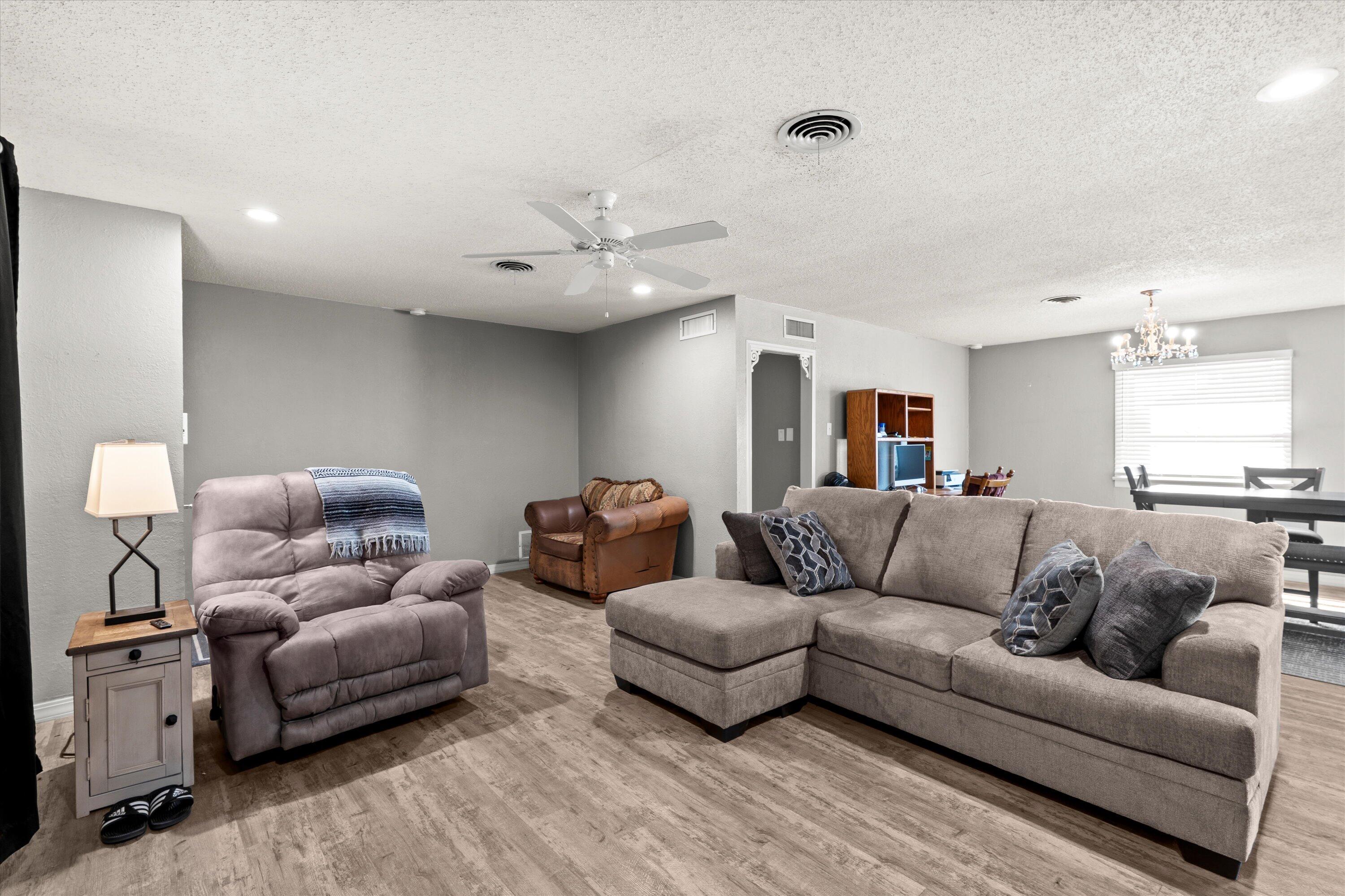 102 3rd Street Plains, TX 79355 - Photo 22 of 29 a living room with furniture and a couch