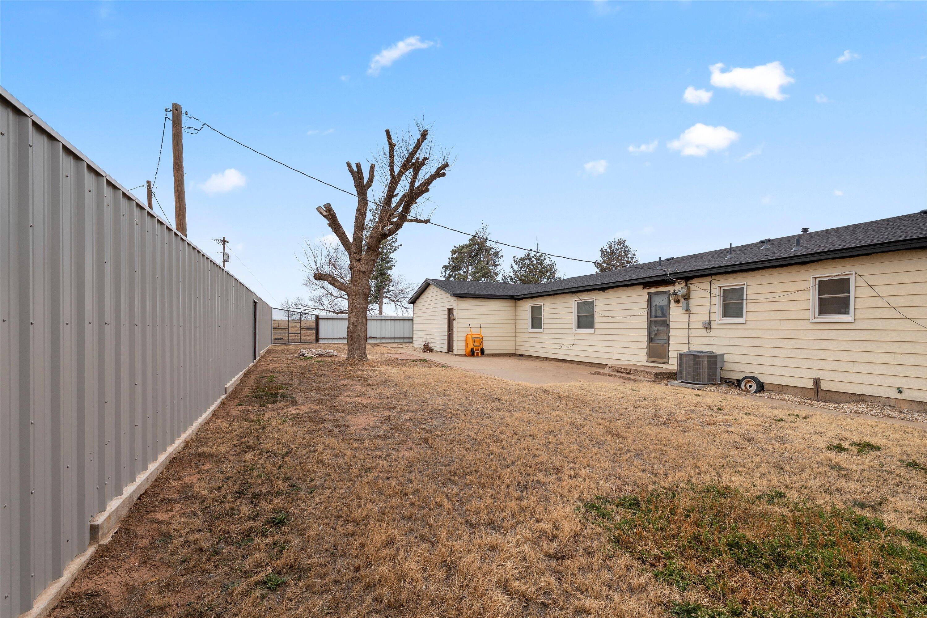102 3rd Street Plains, TX 79355 - Photo 8 of 29 a house view with a backyard space