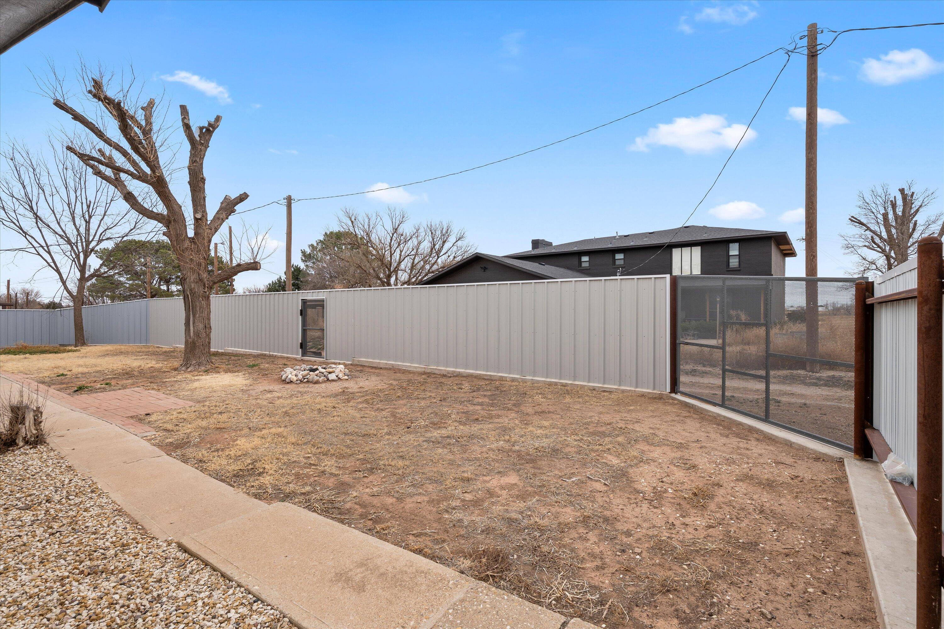 102 3rd Street Plains, TX 79355 - Photo 9 of 29 a view of a backyard