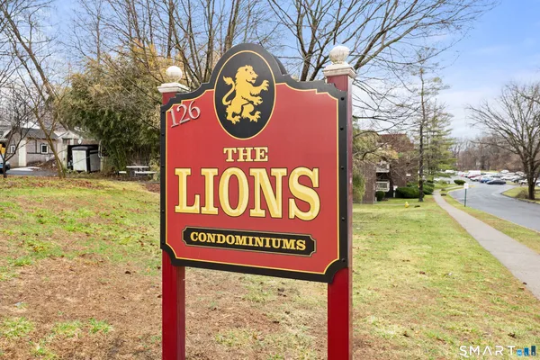 a sign broad on a brick wall