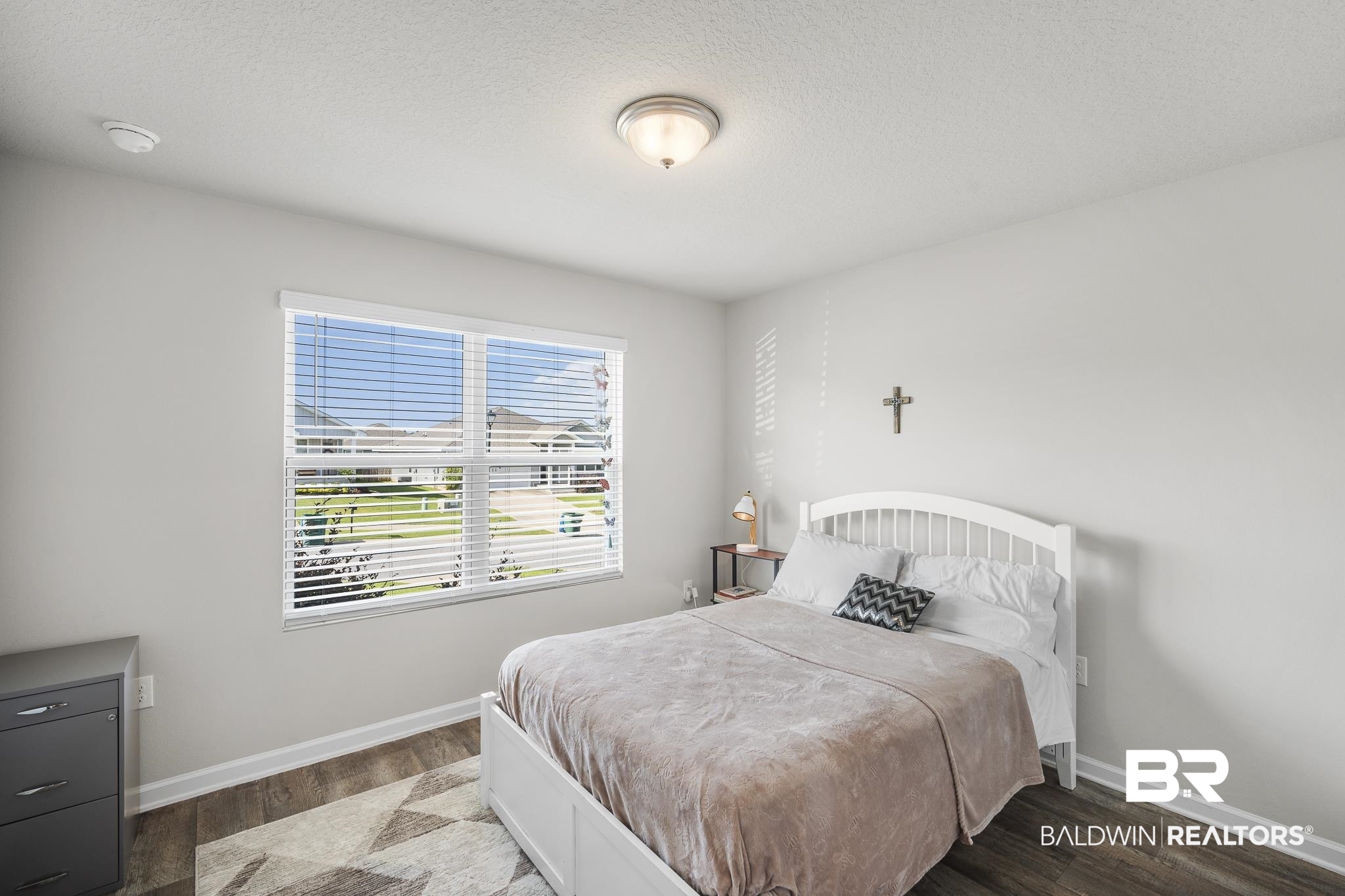 10232 Brodick Loop Spanish Fort, AL 36527 - Photo 19 of 29 Bedroom with wood finished floors and baseboards