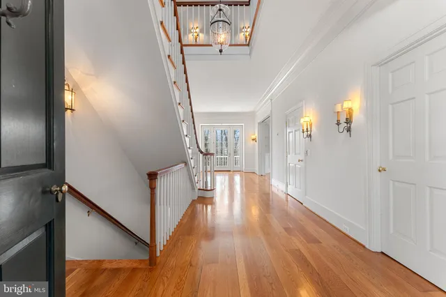a view of a hallway view with wooden floor