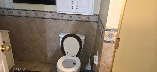 a close view of a utility room with dryer and washer