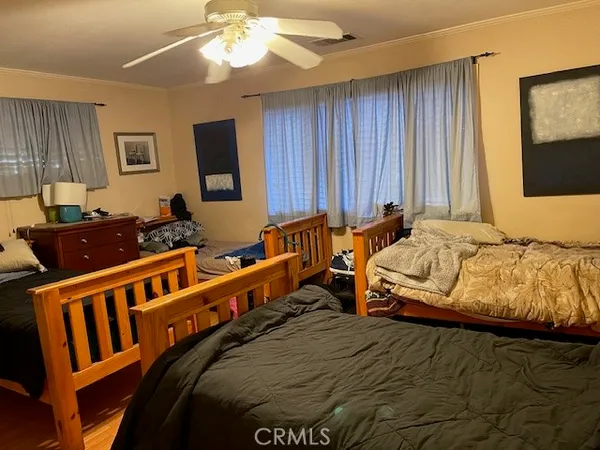 a bedroom with furniture and a window