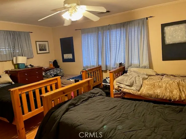 a bedroom with furniture and a window