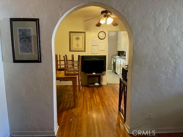 a view of living room with furniture and wooden floor