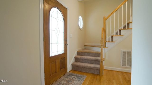a view of entryway with wooden floor
