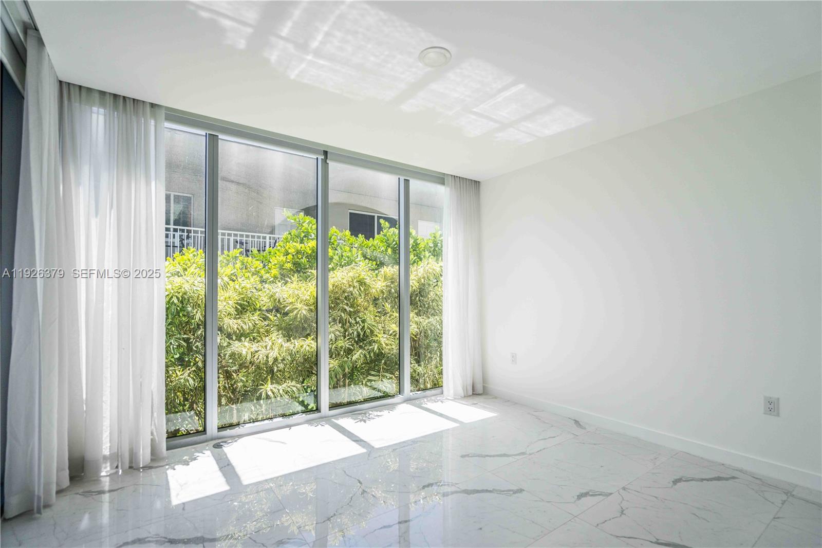 8425 Crespi Boulevard, Unit TH3 Miami Beach, FL 33141 - Photo 11 of 28 a view of a room with a large window