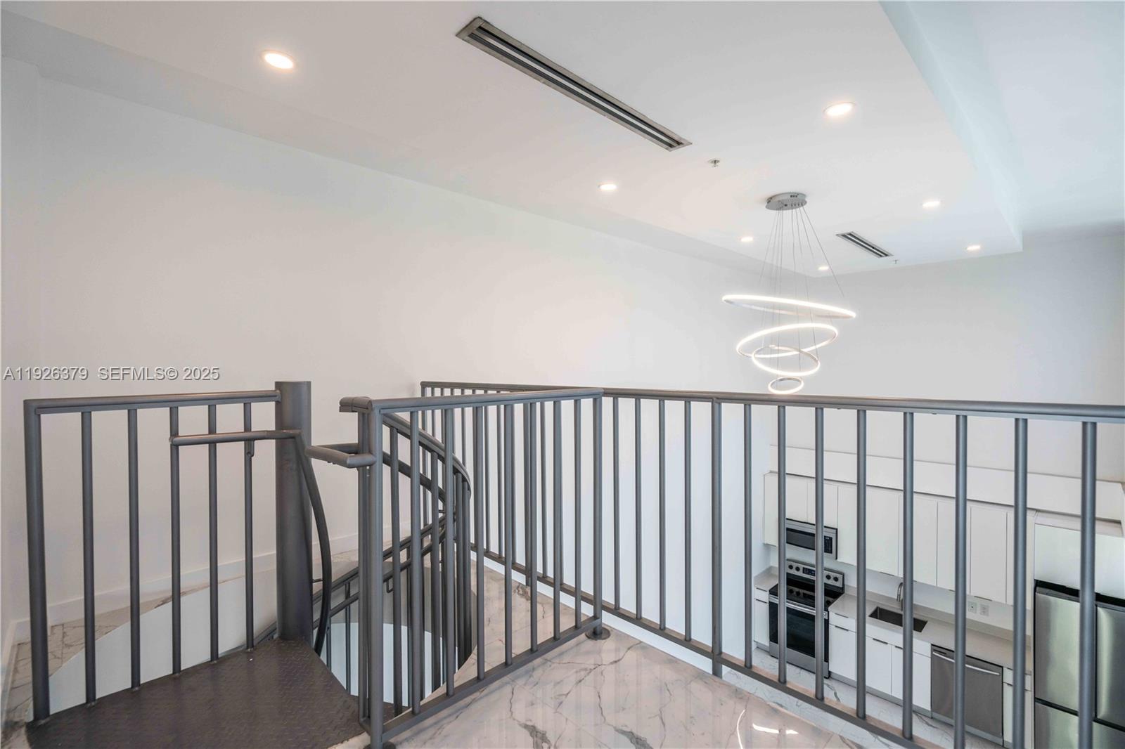 8425 Crespi Boulevard, Unit TH3 Miami Beach, FL 33141 - Photo 16 of 28 a view of staircase with railing in it