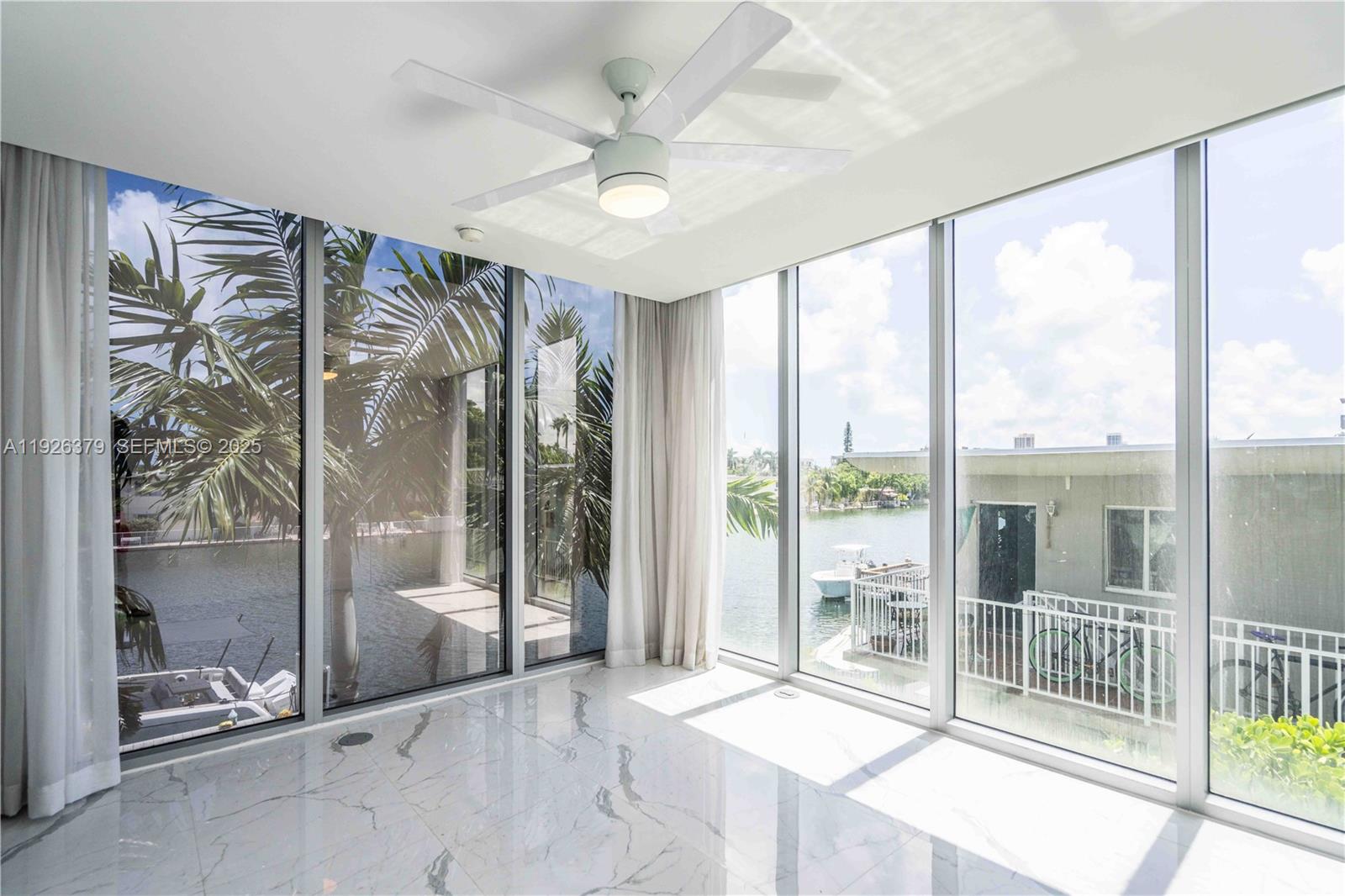 8425 Crespi Boulevard, Unit TH3 Miami Beach, FL 33141 - Photo 20 of 28 a view of a room with a large window